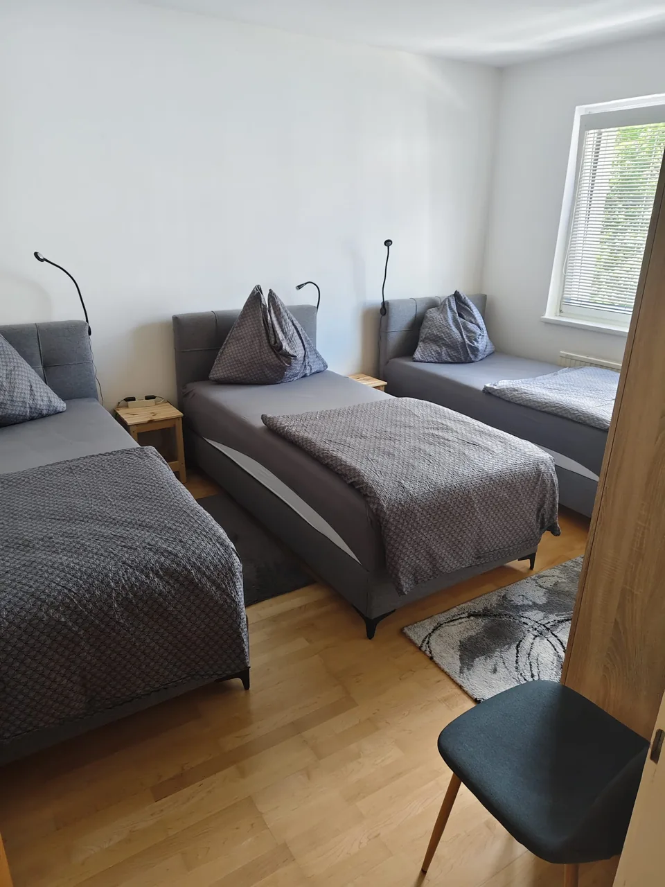 Schlafbereich mit Einzelbetten im Apartment Liezen